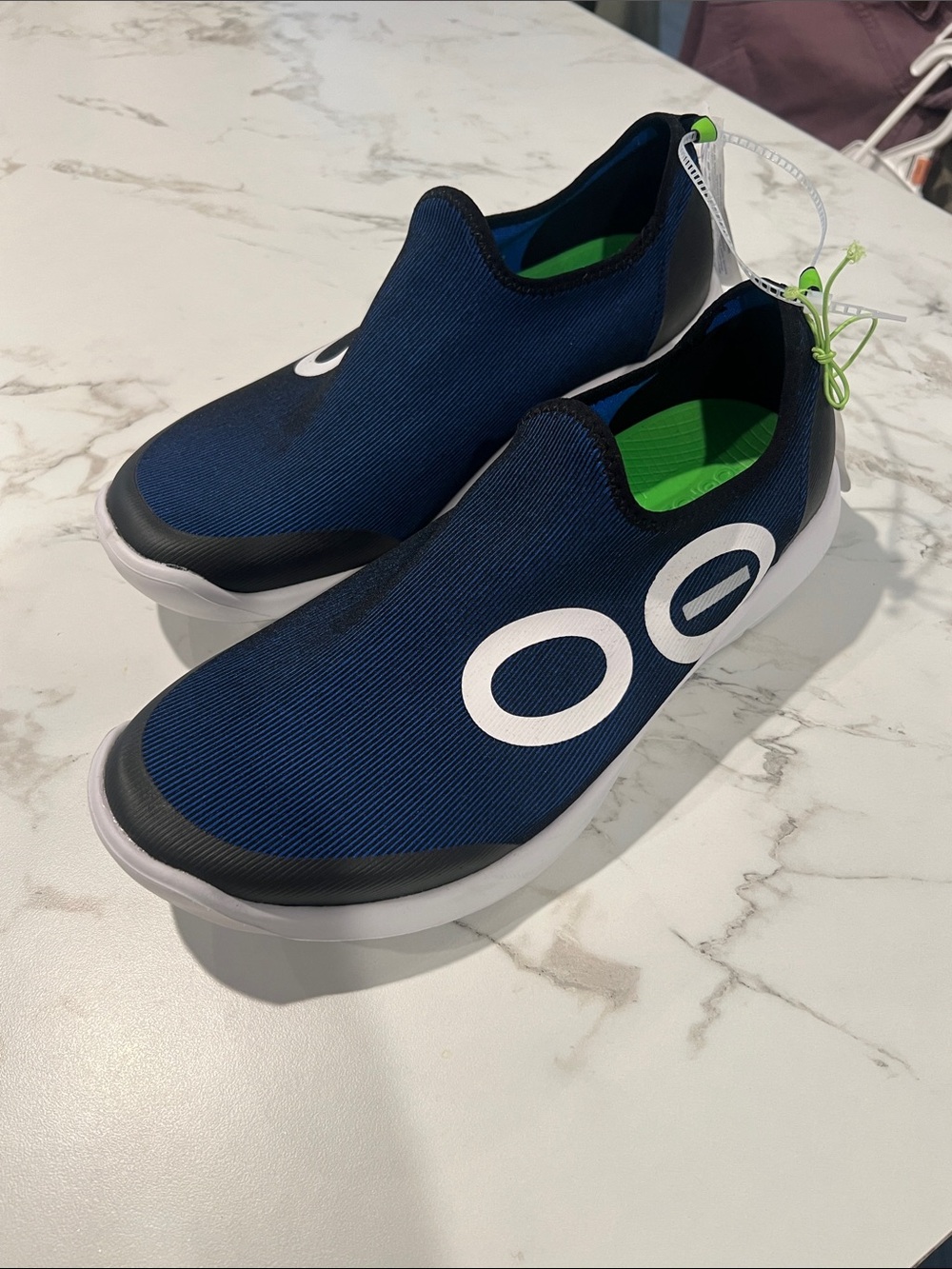 OOFOS Navy Blue and White Slip-On Sneakers with Green Insole